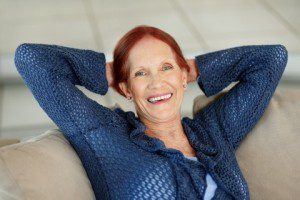 happy mature female relaxing on sofa red head dreamstime 15739759