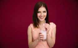 7 Reasons Your Gut Will Love Probiotic Rich Kefir 4 640 bigstock Happy woman holding glass with 87462104